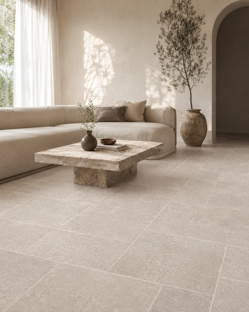 126G003 light grey-beige stone-look porcelain tile in sunlit architectural living room
